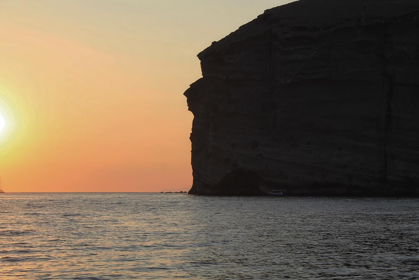 Photo of a Cliff taken from sea level, at golden hour
