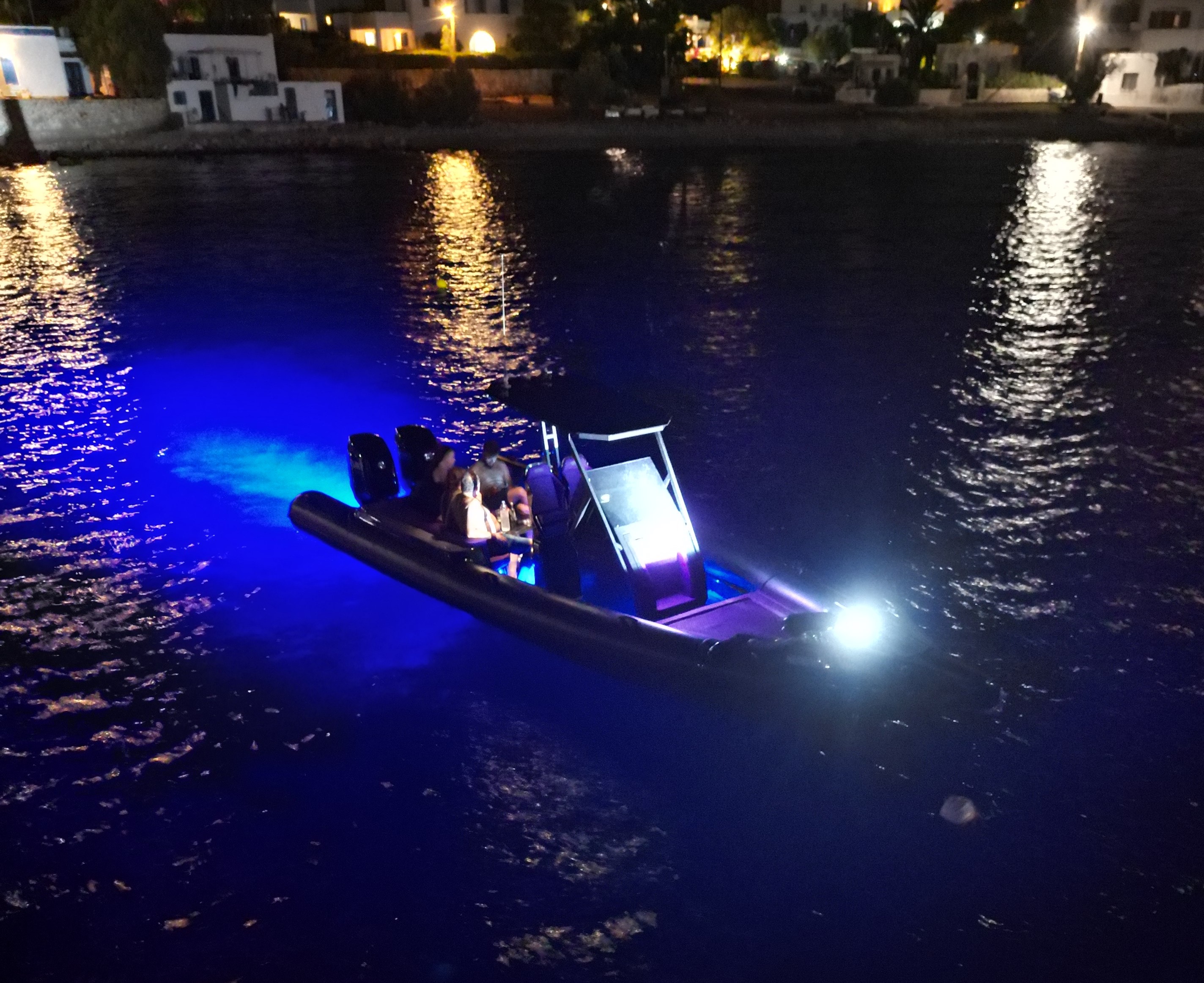 Nephele boat by night with lights on